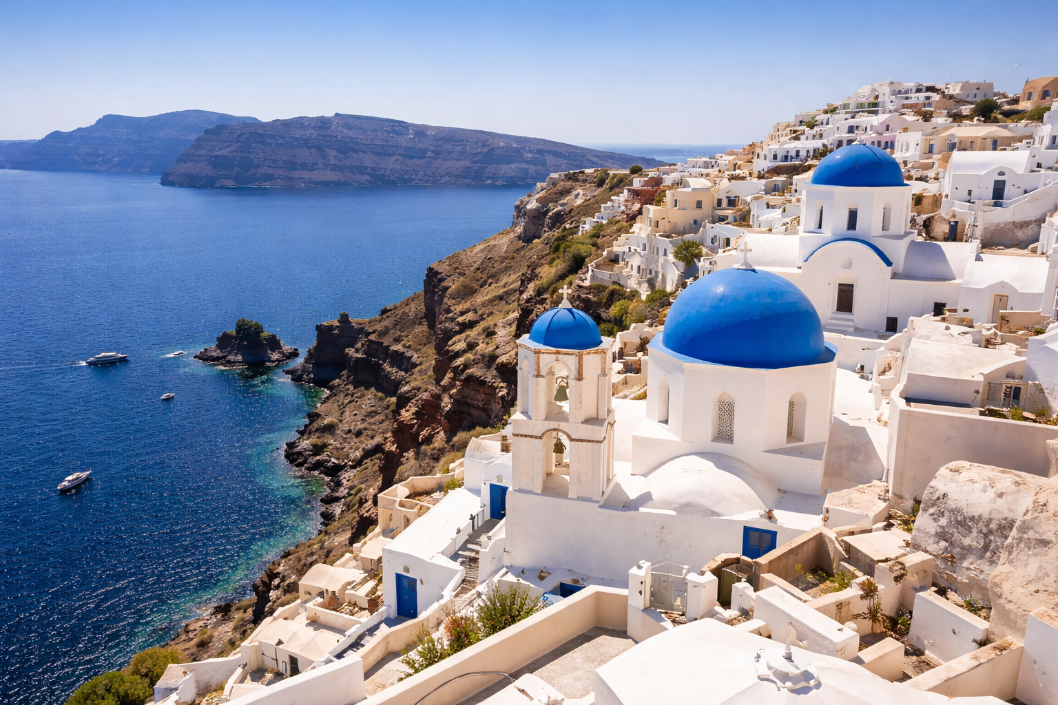 Santorini white-washed buildings overlooking the Aegean Sea